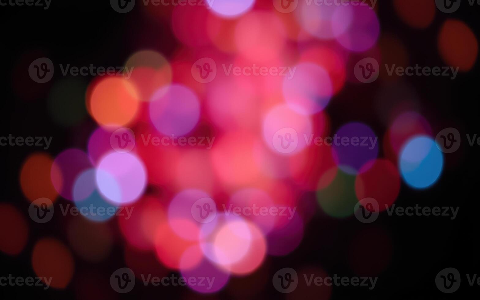 Colorful bokeh lights create a vibrant atmosphere during a festive celebration at night photo
