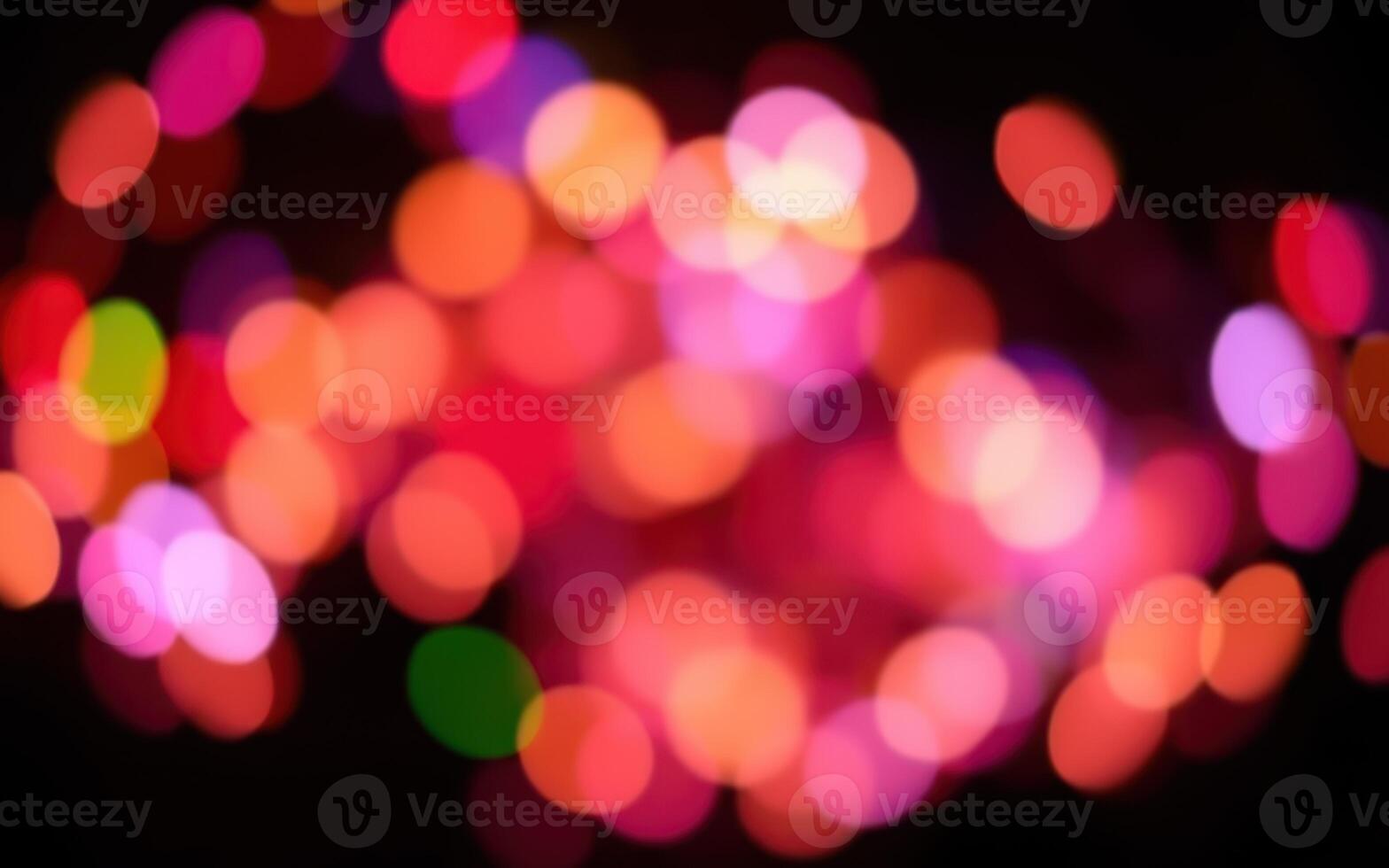 Colorful bokeh lights create a festive atmosphere during a celebration in a vibrant urban setting photo