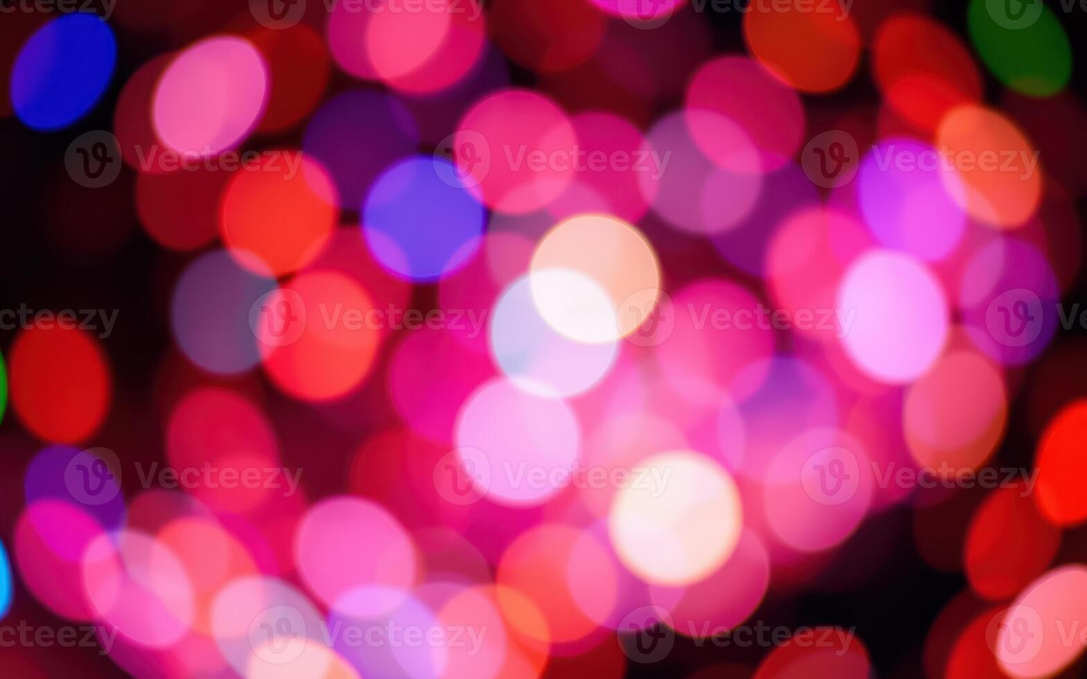 Colorful blurred lights create a vibrant atmosphere during an evening event in a festive setting photo