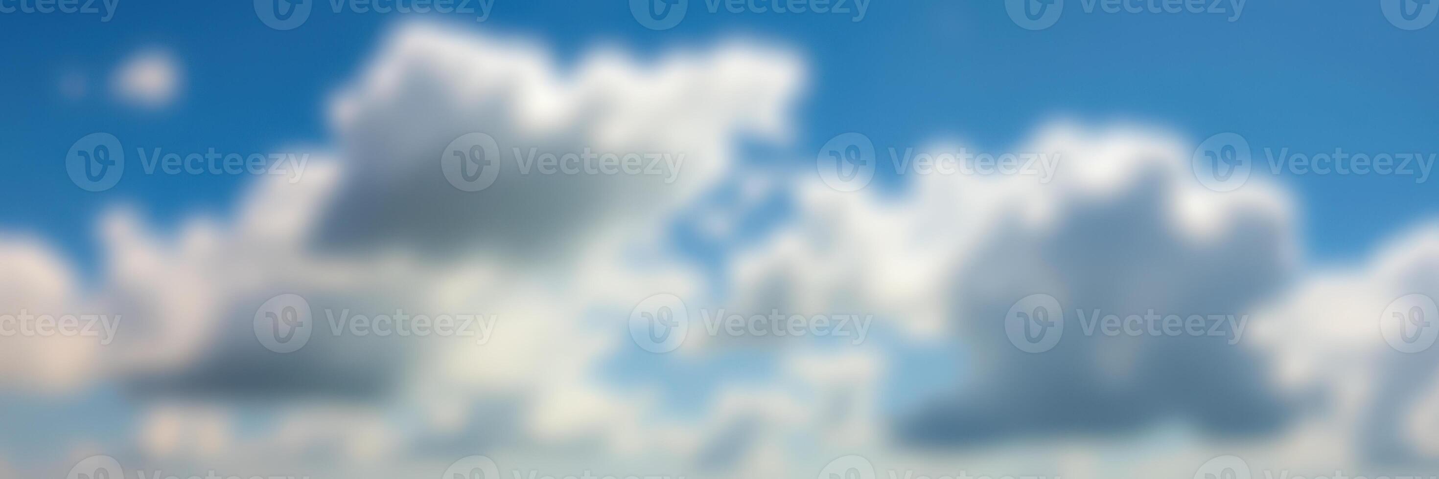 Clouds drift softly across a blue sky during the afternoon, creating a serene and tranquil atmosphere photo