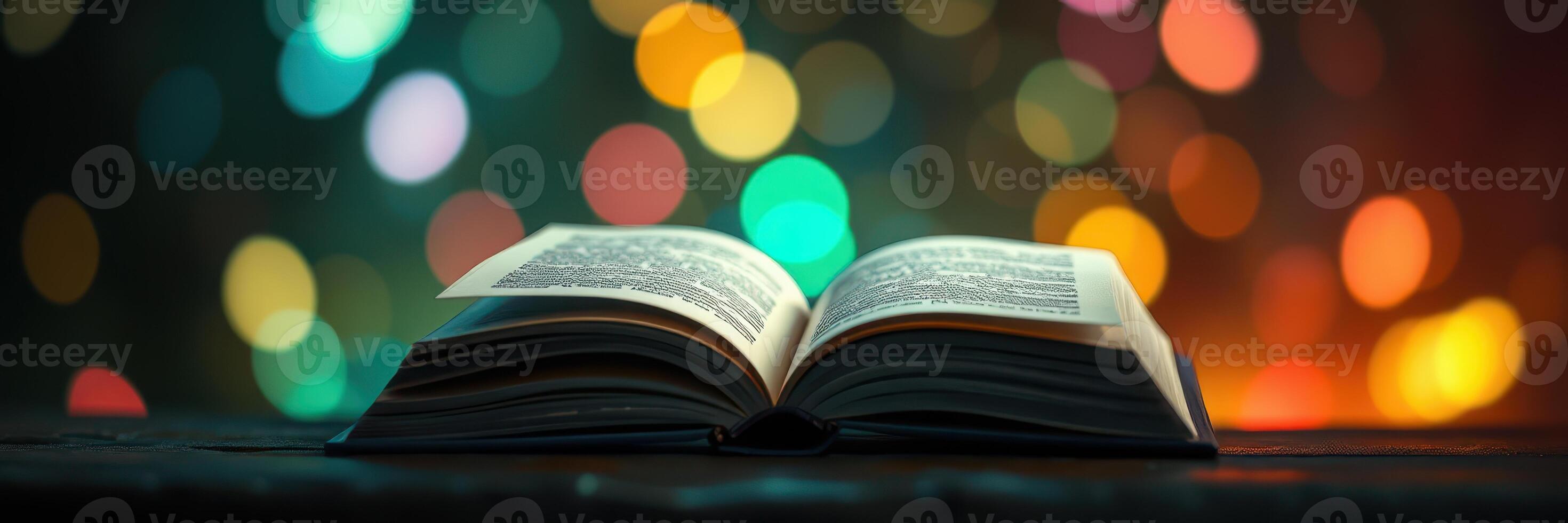 Open book with illuminated pages resting on a table amidst colorful bokeh lights in a cozy atmosphere photo