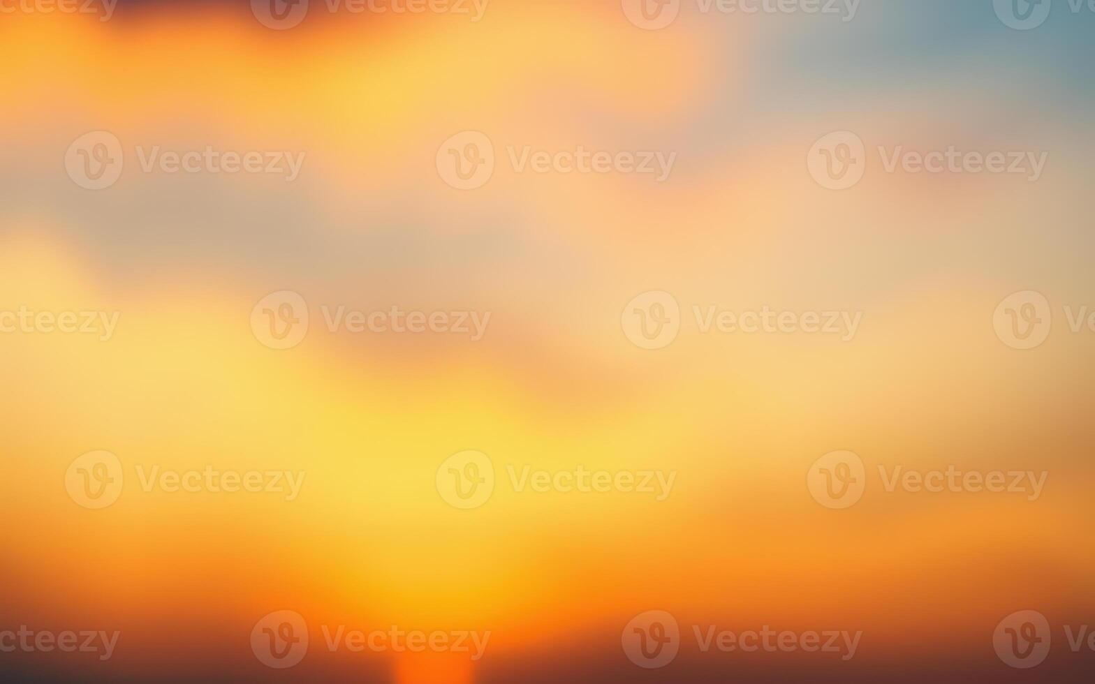 Vibrant sunset over a tranquil horizon with soft clouds illuminated by warm colors photo