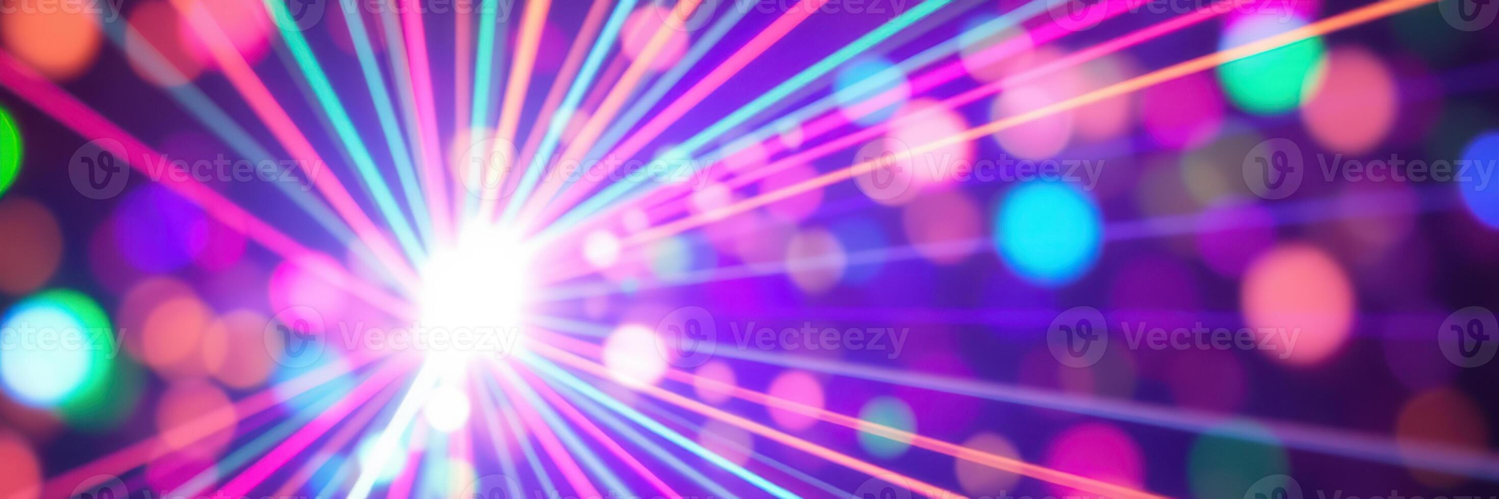 Colorful light beams create a vibrant atmosphere at a night event with disco balls and lively music photo