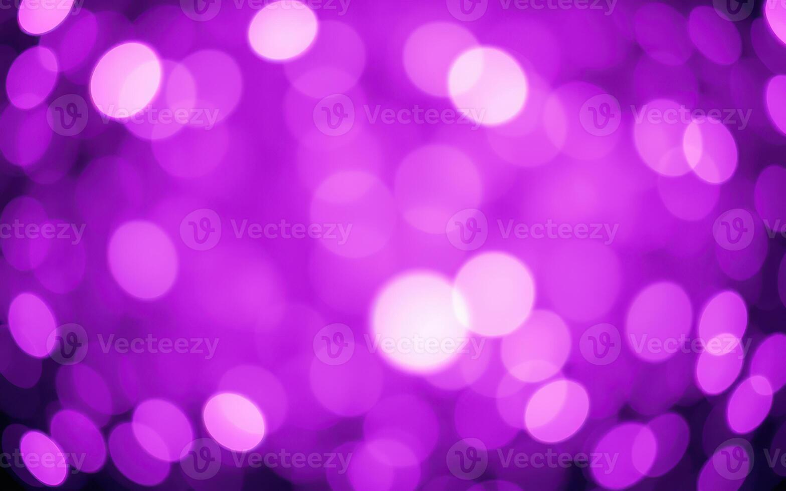Colorful bokeh lights create a vibrant purple atmosphere at a lively event or celebration at night photo