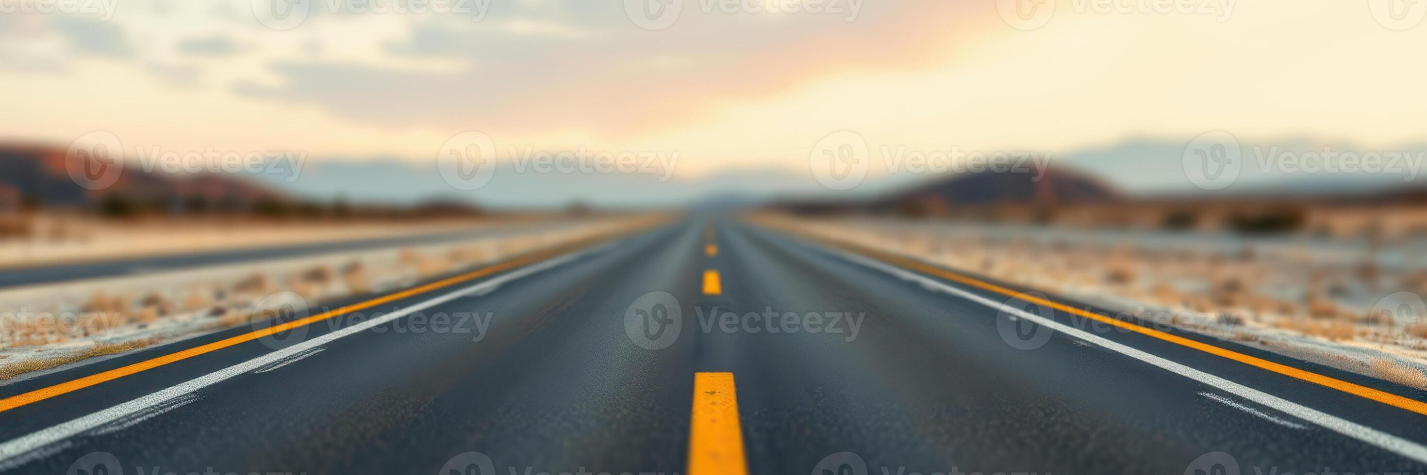 Endless stretch of highway under a pastel sky at sunrise invites adventure and exploration across the desert landscape photo