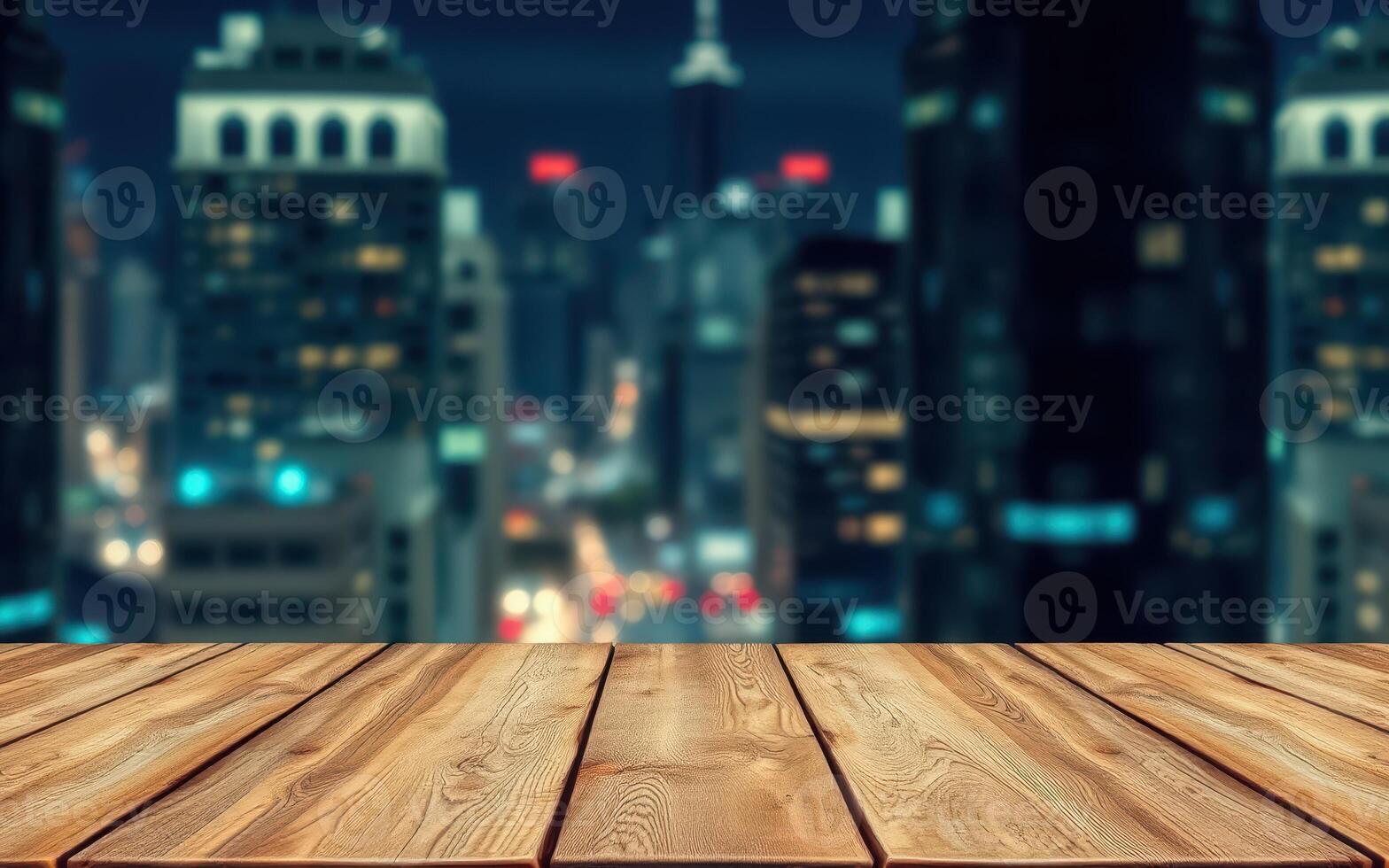 Night view of a city skyline with focus on a wooden table in the foreground and urban lights in the background photo