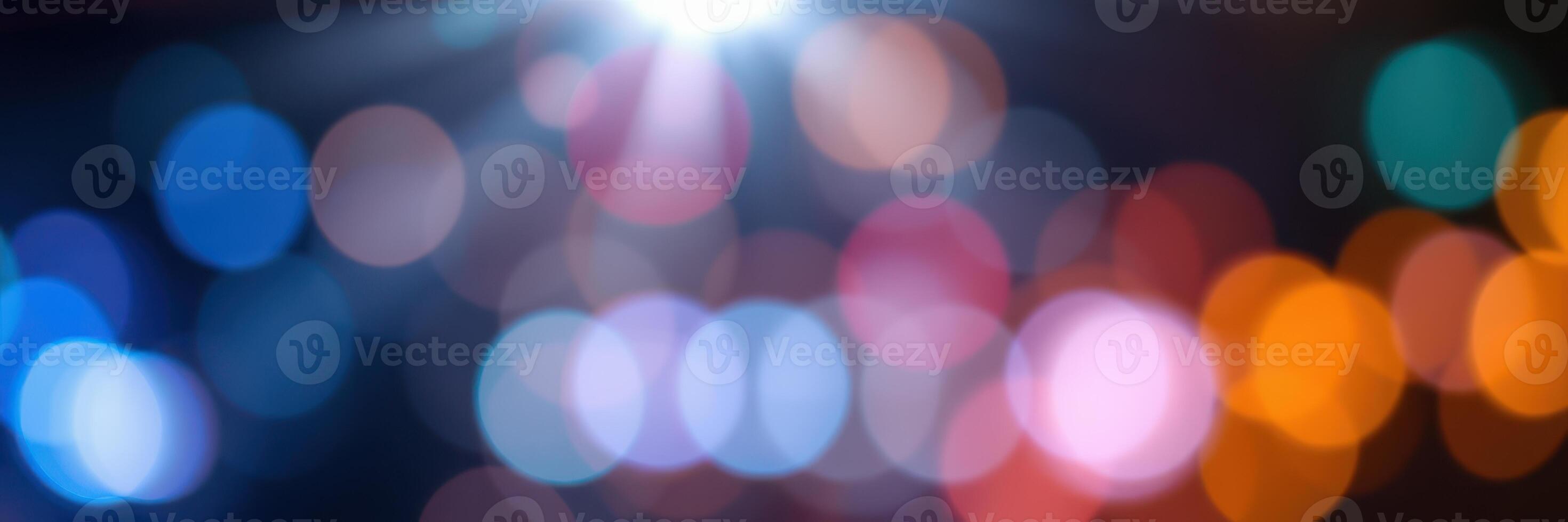 Colorful bokeh lights create a vibrant atmosphere in a nighttime urban setting during a festive celebration photo