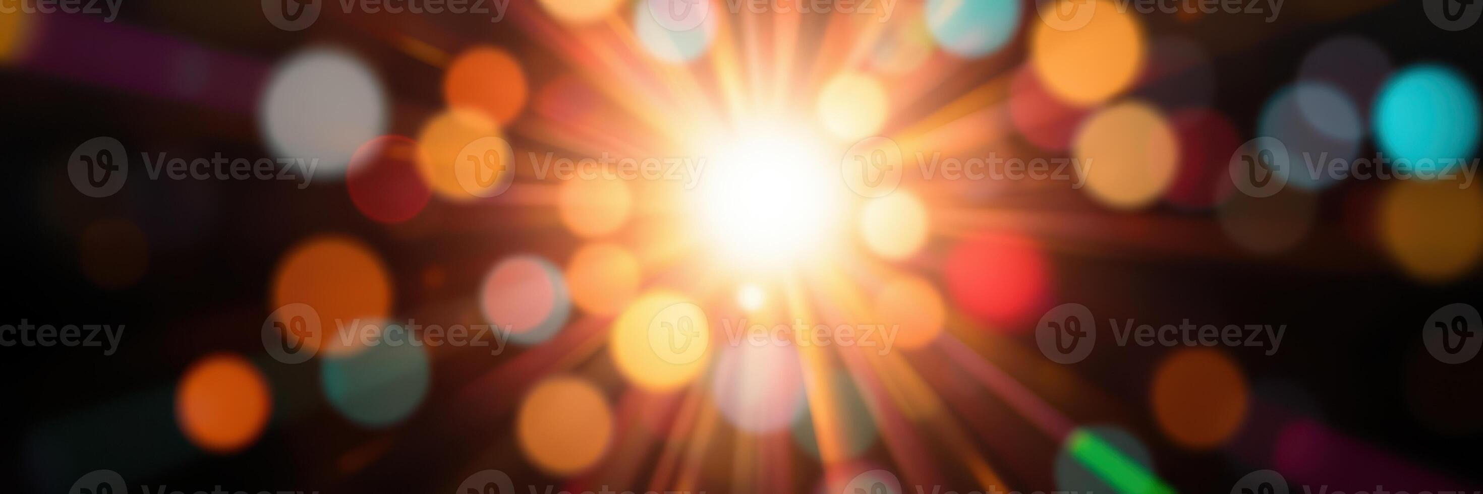 Radiant burst of light with colorful bokeh effects creating a mesmerizing atmosphere at night photo