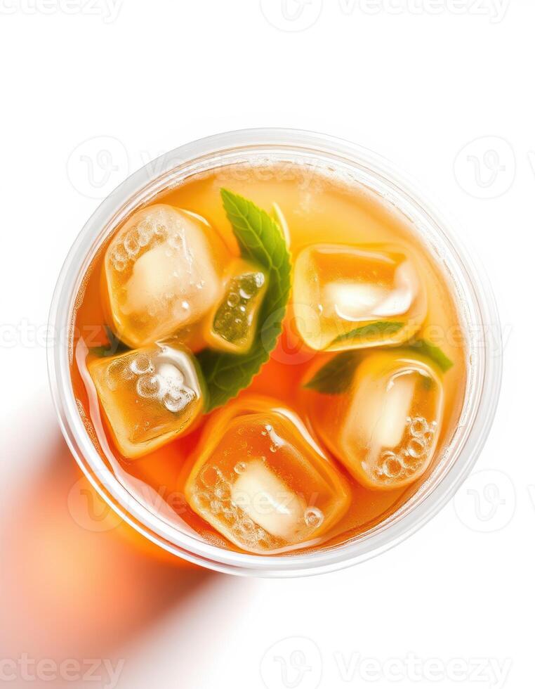 Refreshing iced tea with mint leaves and ice cubes served in a clear cup for a cooling summer drink photo