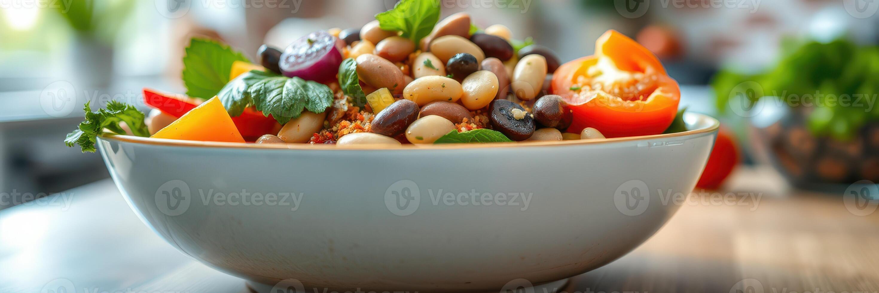 Fresh bean salad with colorful vegetables and herbs served in a rustic bowl on a wooden table photo