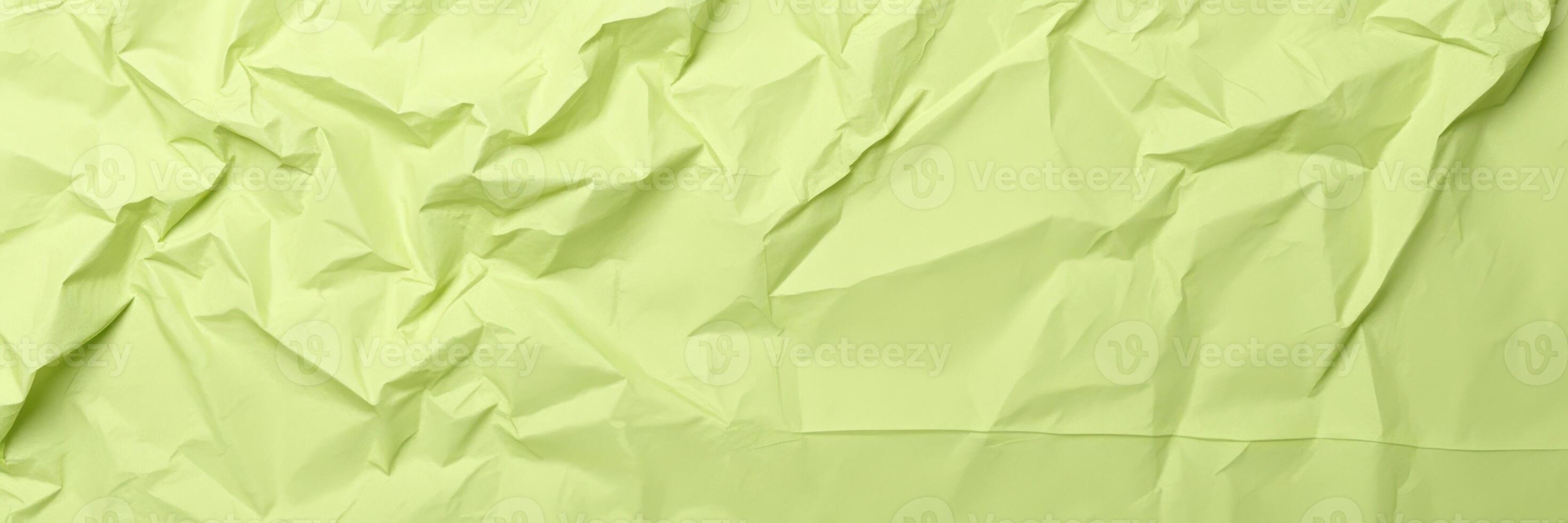 Crumpled light green paper texture used for creative and artistic projects or backgrounds in design work photo