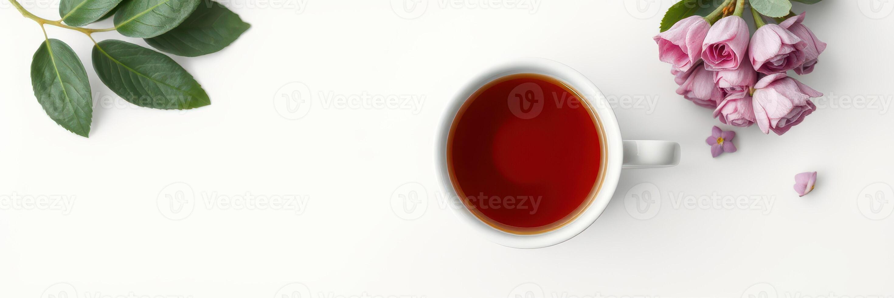 Freshly brewed tea beside soft pink roses on a clean surface in a bright, serene setting photo