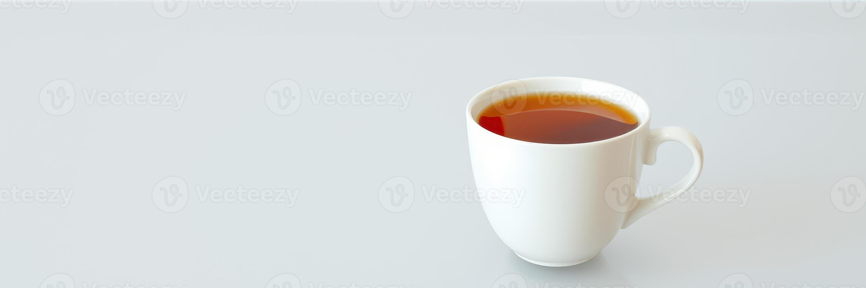 Warm cup of tea placed on a minimalistic white table during a calm afternoon photo