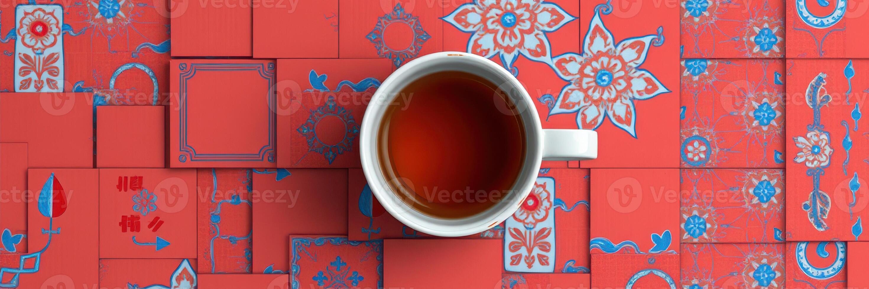Tea cup resting on vibrant red decorative tiles with intricate patterns, showcasing a blend of culture and artistry photo