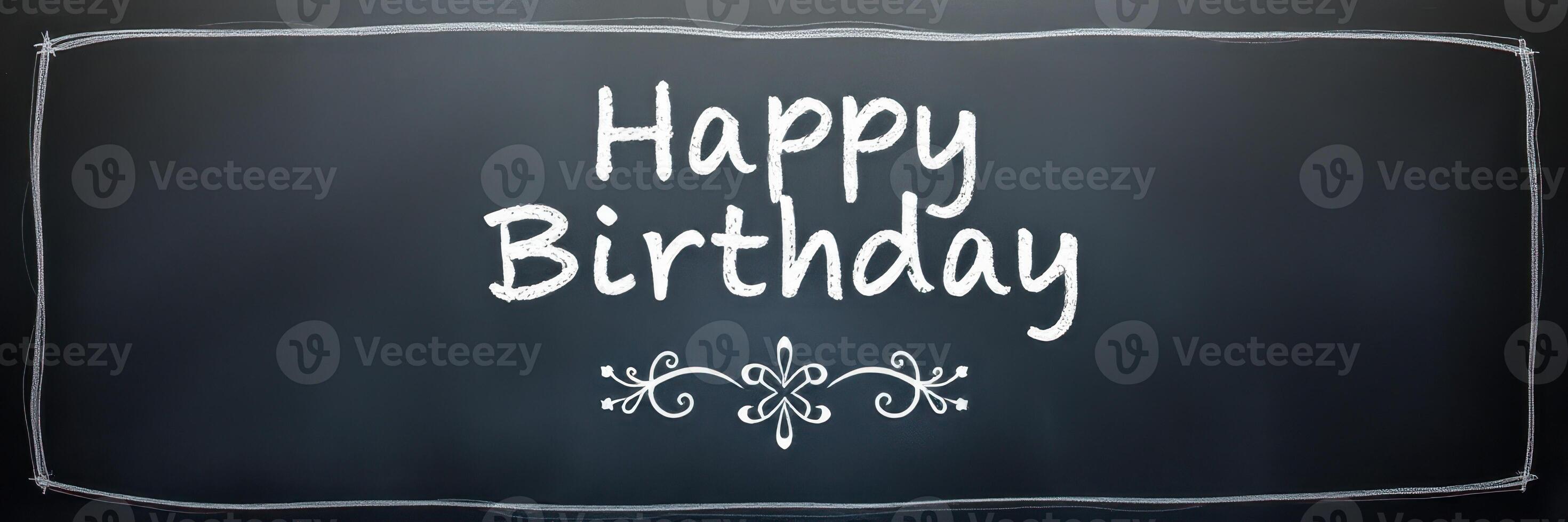 Celebration message written in chalk on a blackboard for a birthday occasion photo