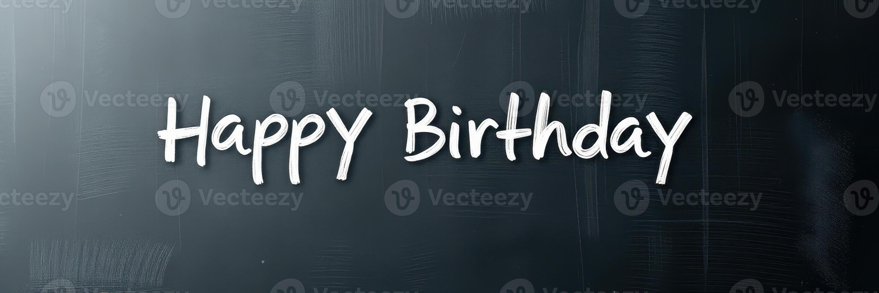 Happy Birthday greeting written in chalk on a blackboard for celebration of a special day photo
