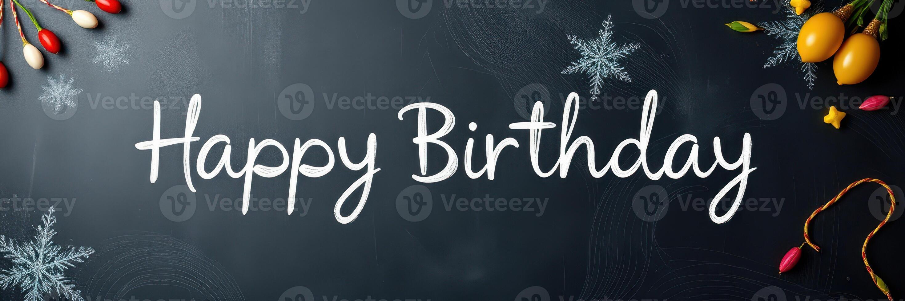 Happy birthday greeting with festive decorations and winter elements on a chalkboard background photo
