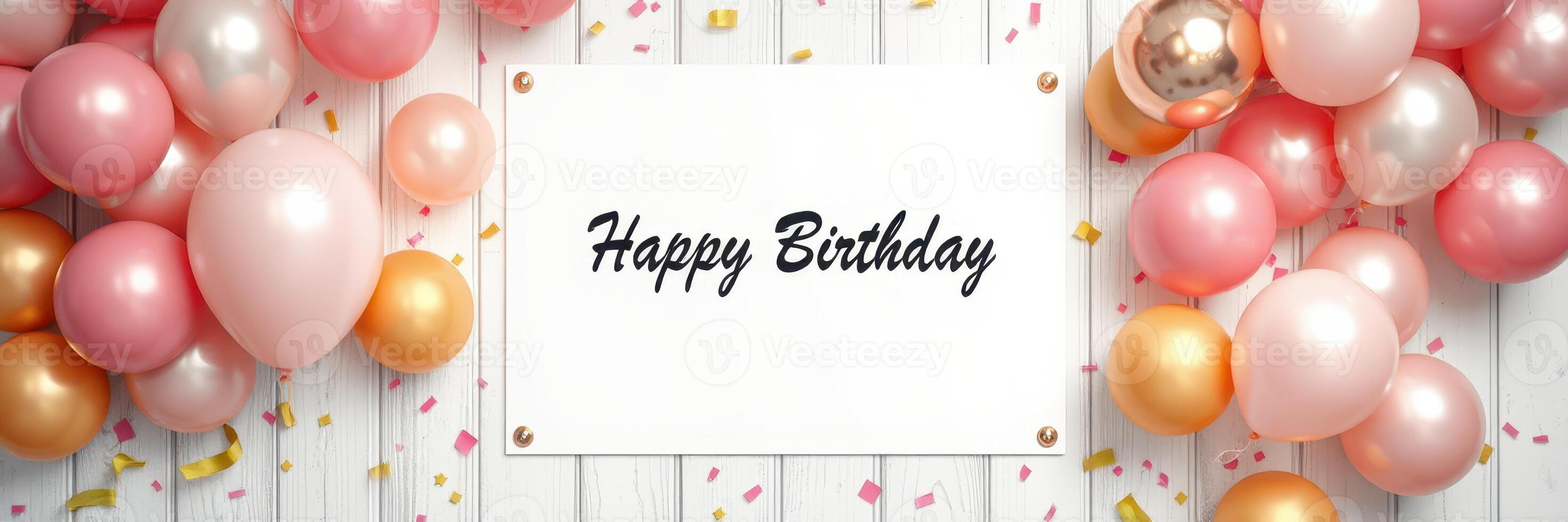 Colorful birthday decorations with balloons and a greeting sign on a wooden background photo