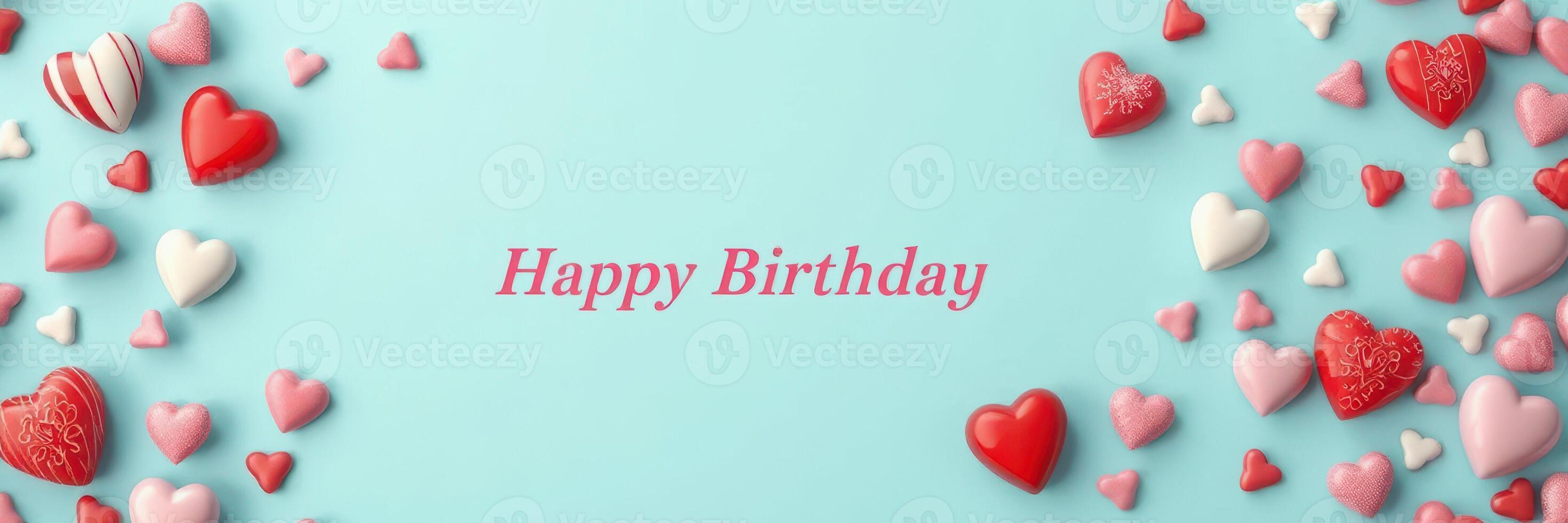 Colorful heart decorations create a festive atmosphere for a birthday celebration with a light blue background photo