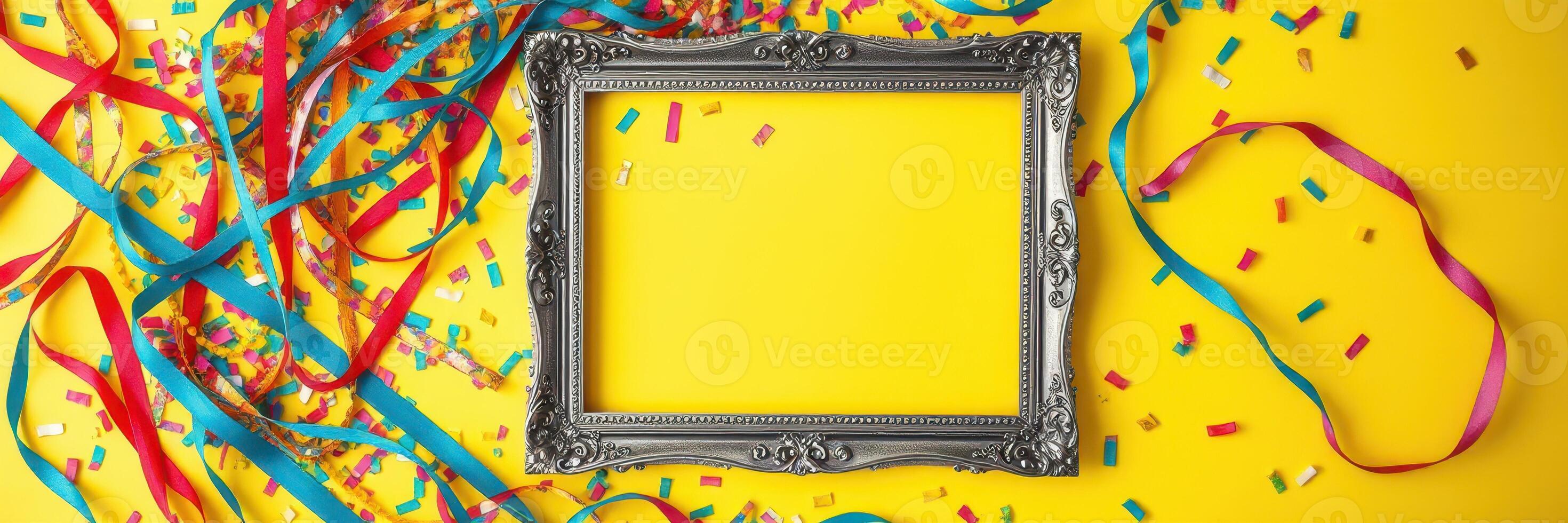 Colorful celebration with an empty silver frame surrounded by vibrant ribbons and confetti on a bright yellow background photo