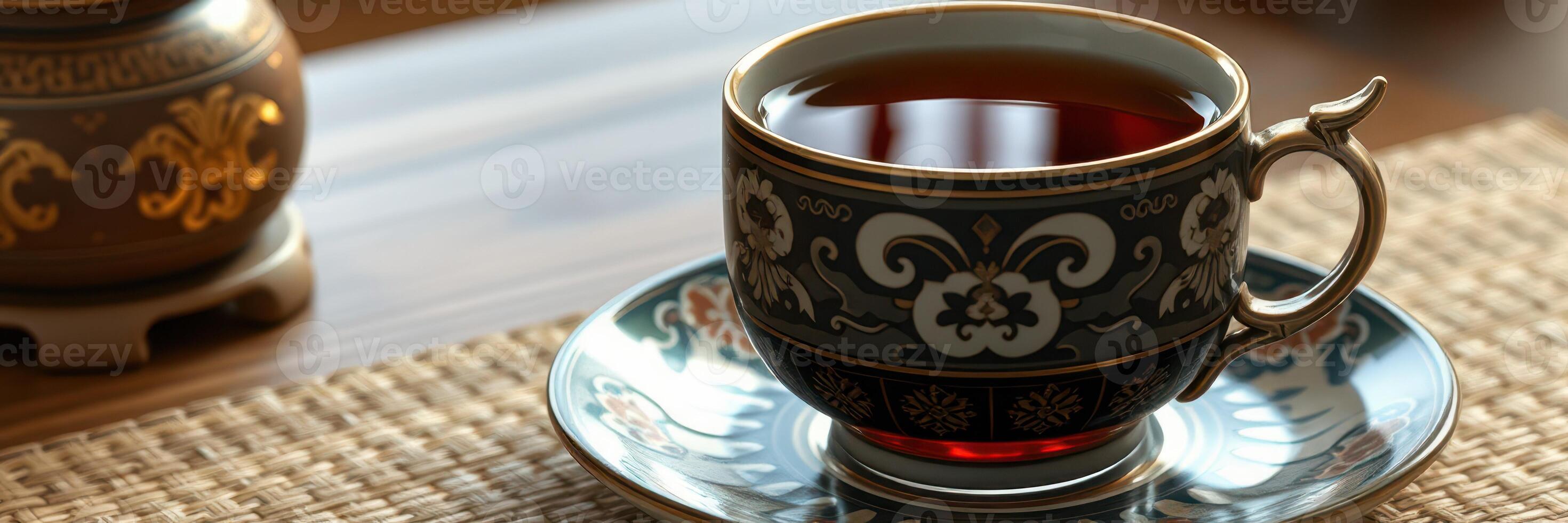 Elegant tea in a beautifully designed cup resting on a stylish mat during an afternoon gathering photo