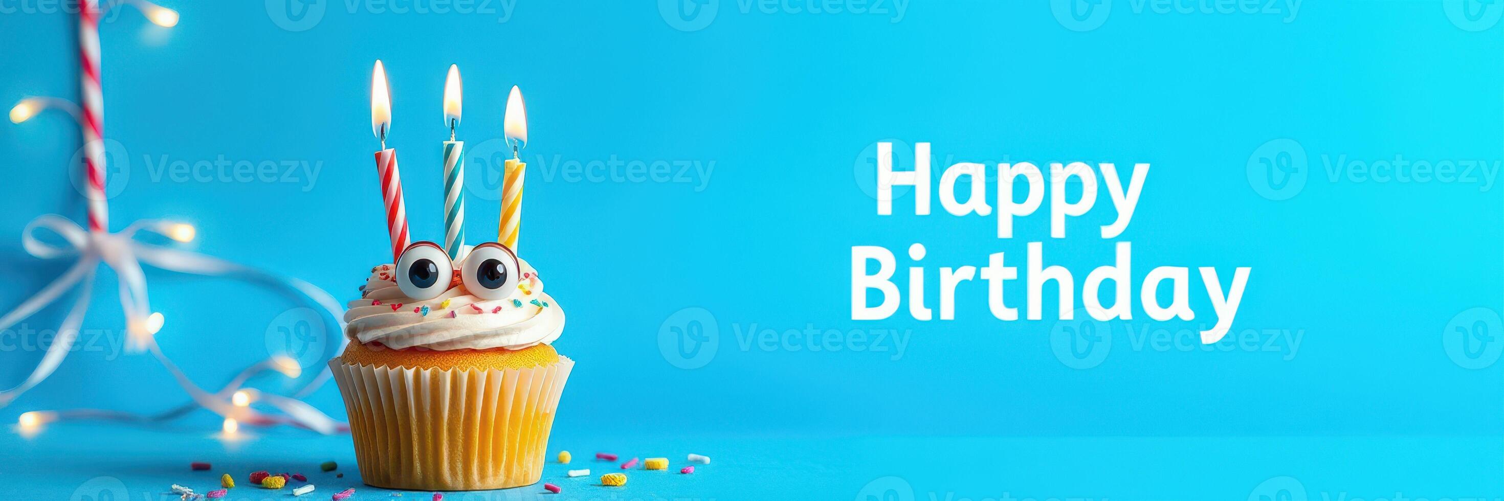 Colorful birthday cupcake with candles and decorations celebrating a special occasion photo