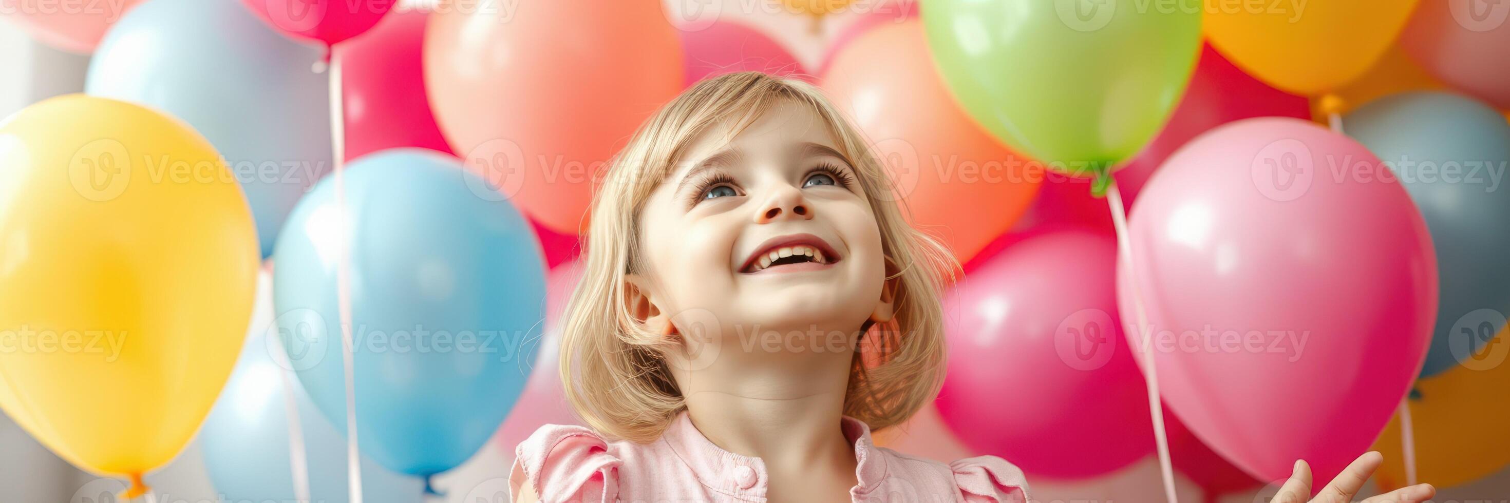 Happy child celebrating with colorful balloons at a festive party indoors photo