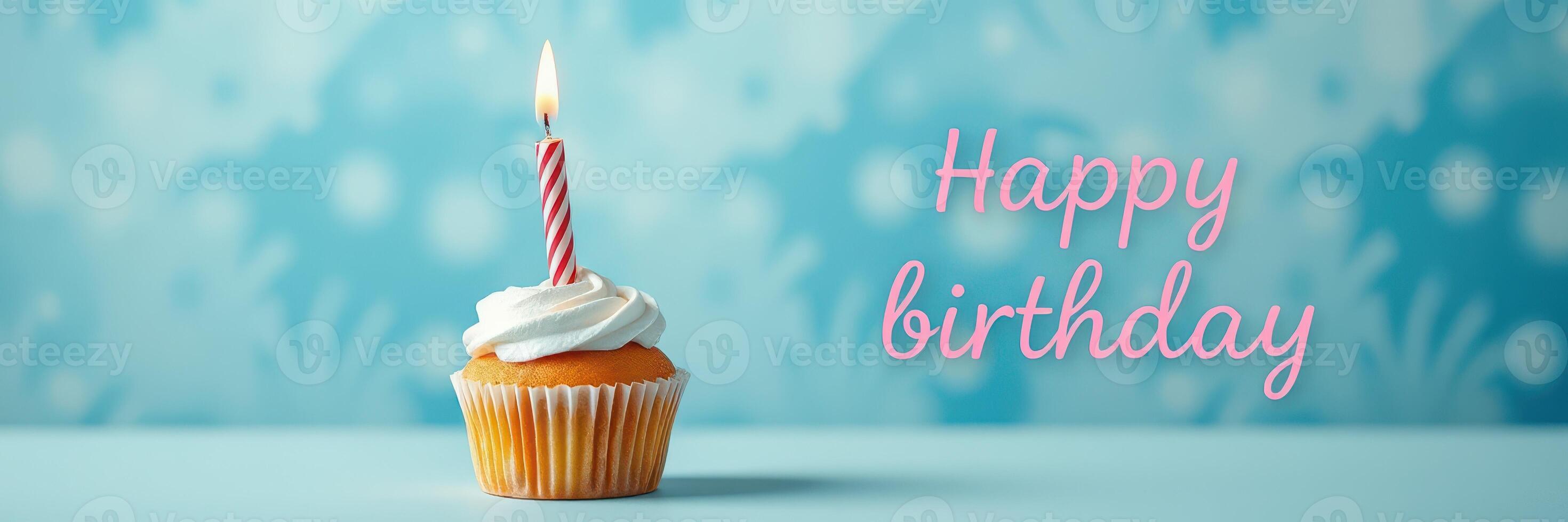Celebration of a birthday with a festive cupcake adorned with a candle on a blue background photo