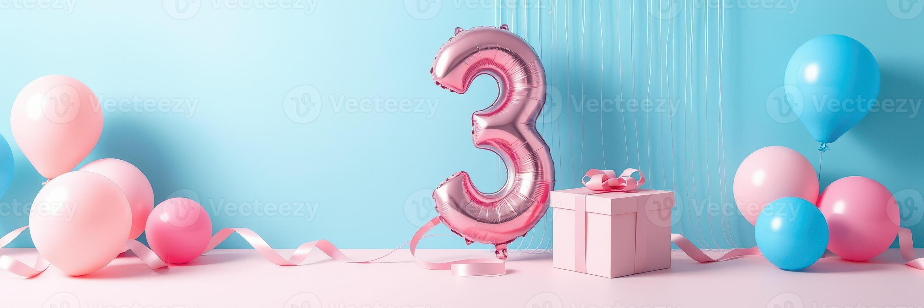 Colorful birthday decorations with pink and blue balloons and a gift box celebrating a child's third birthday photo