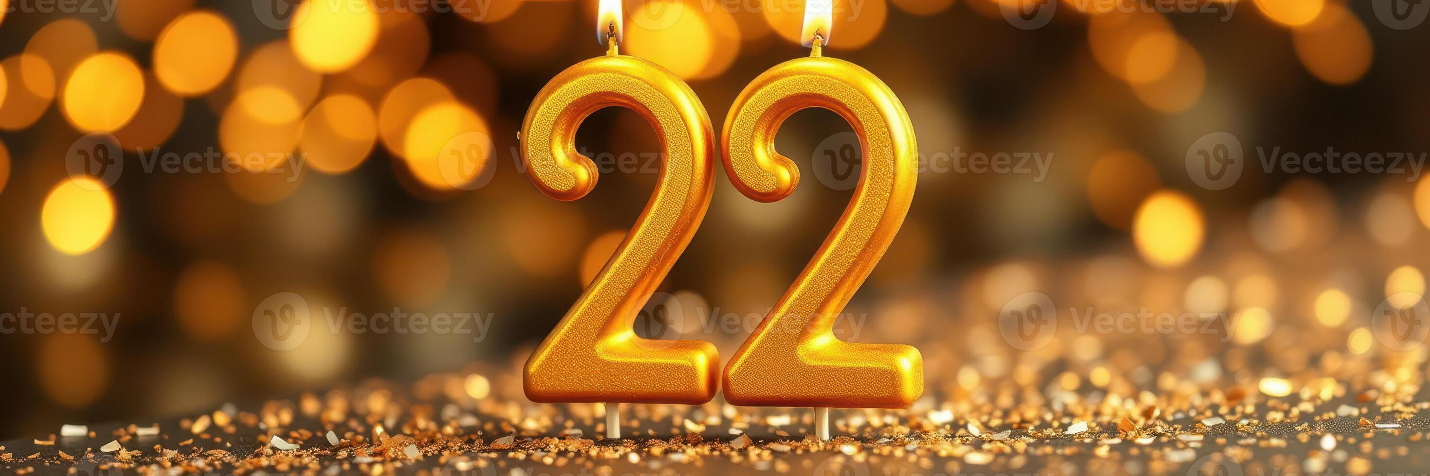 Golden candles display the number 22, symbolizing celebration and joy in a festive setting photo