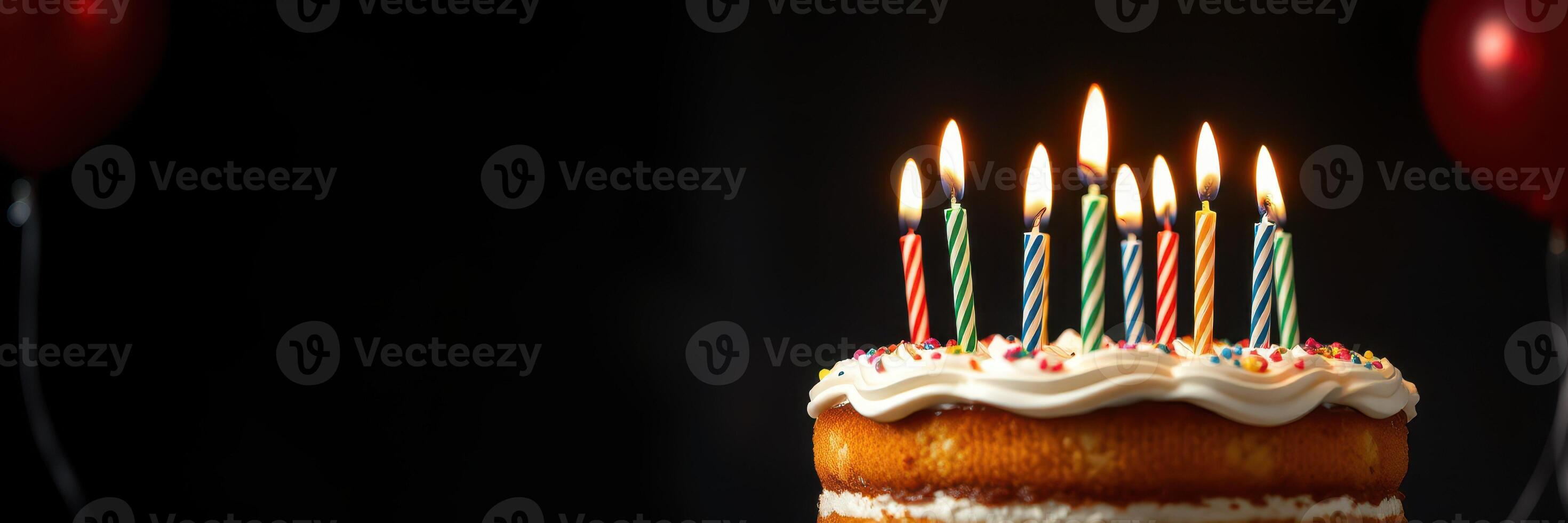 Celebration of a special occasion with a decorated cake and lit candles in a festive environment photo