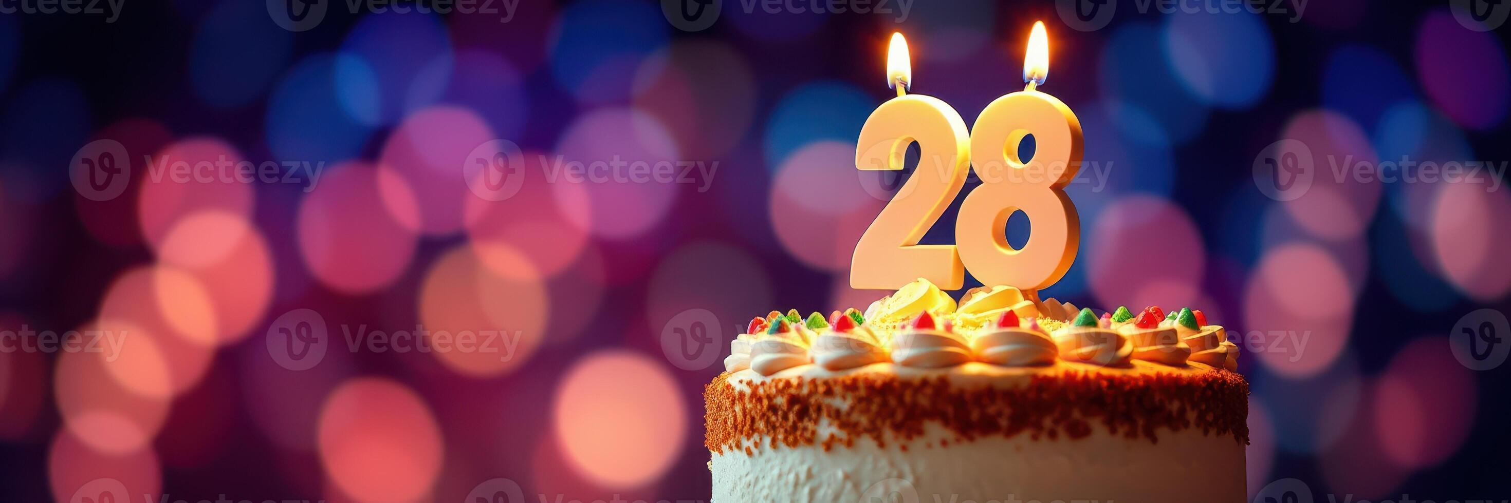 Celebrating a special birthday with a cake adorned with candles shining brightly for the 28th year photo
