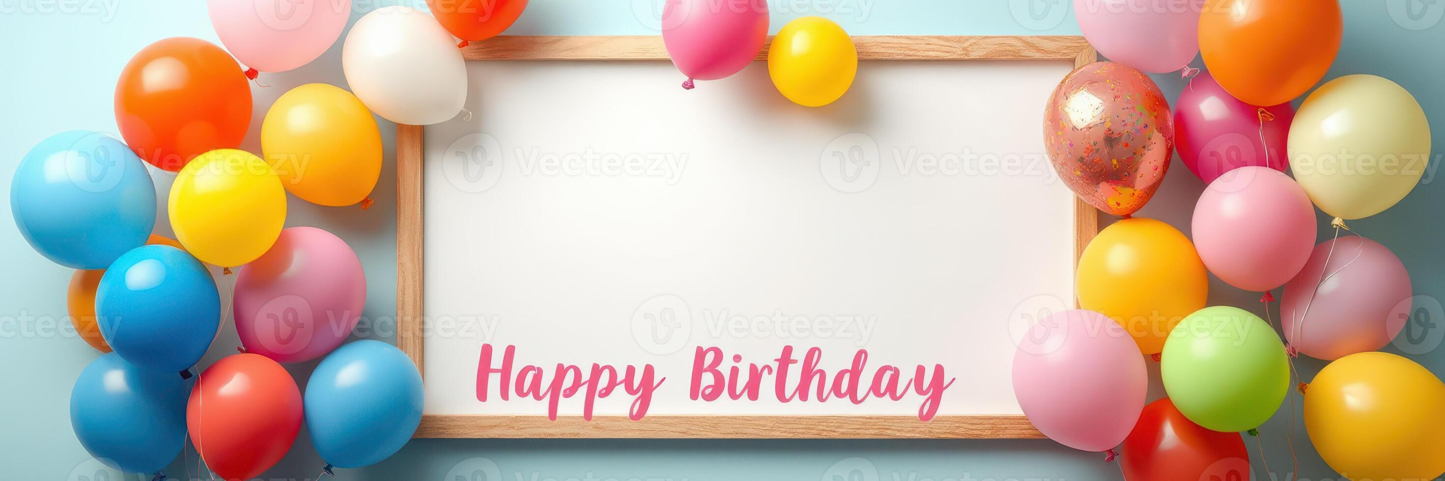 Colorful birthday celebration setup with balloons and empty frame for customizing messages in a cheerful environment photo