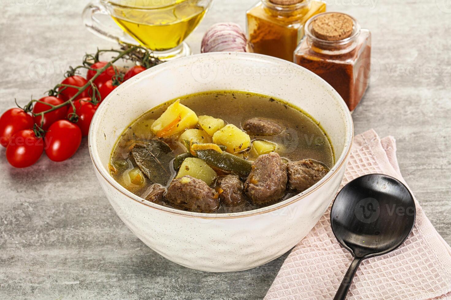Soup with meatball and potato photo