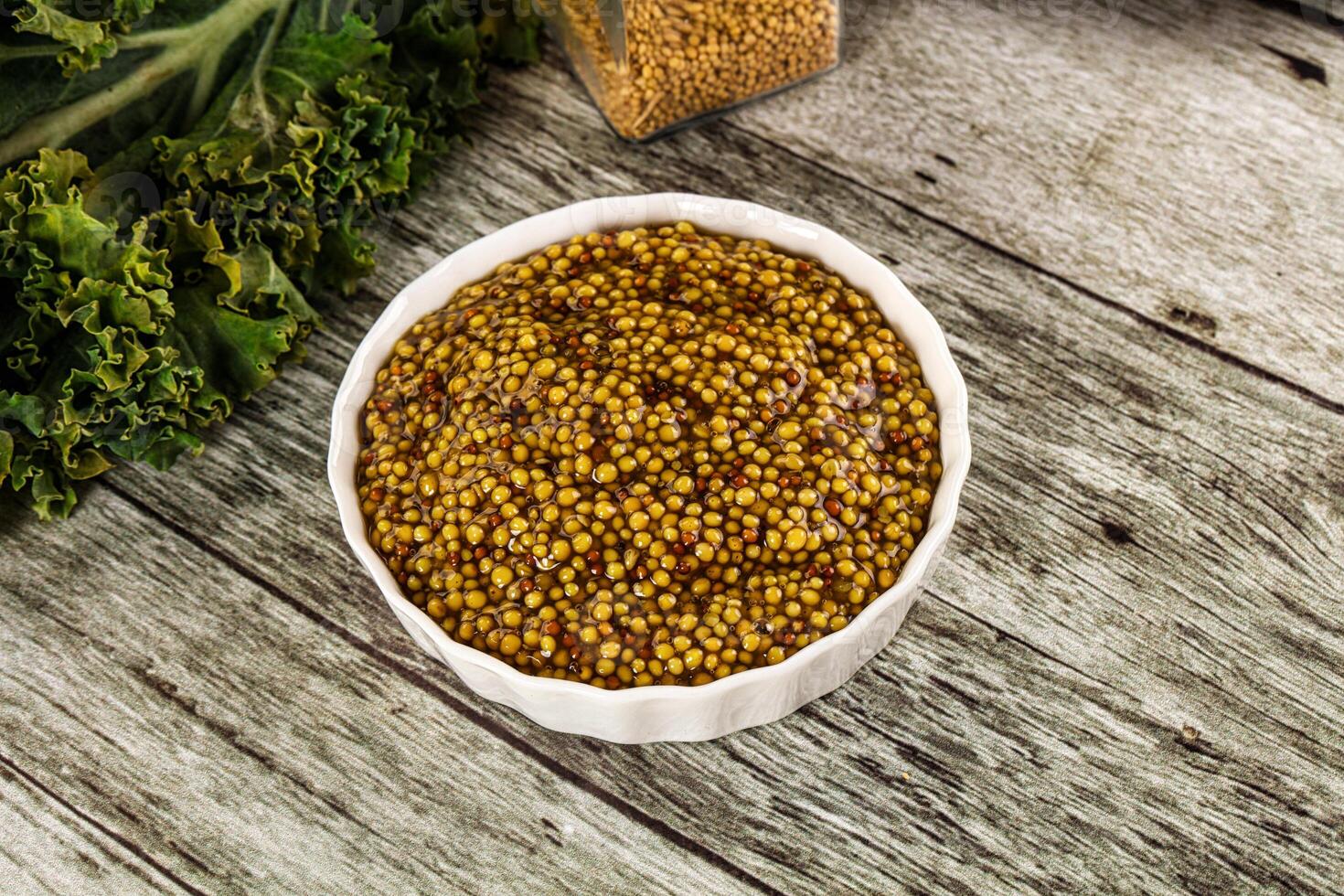 Mustard sauce with seeds in the bowl photo