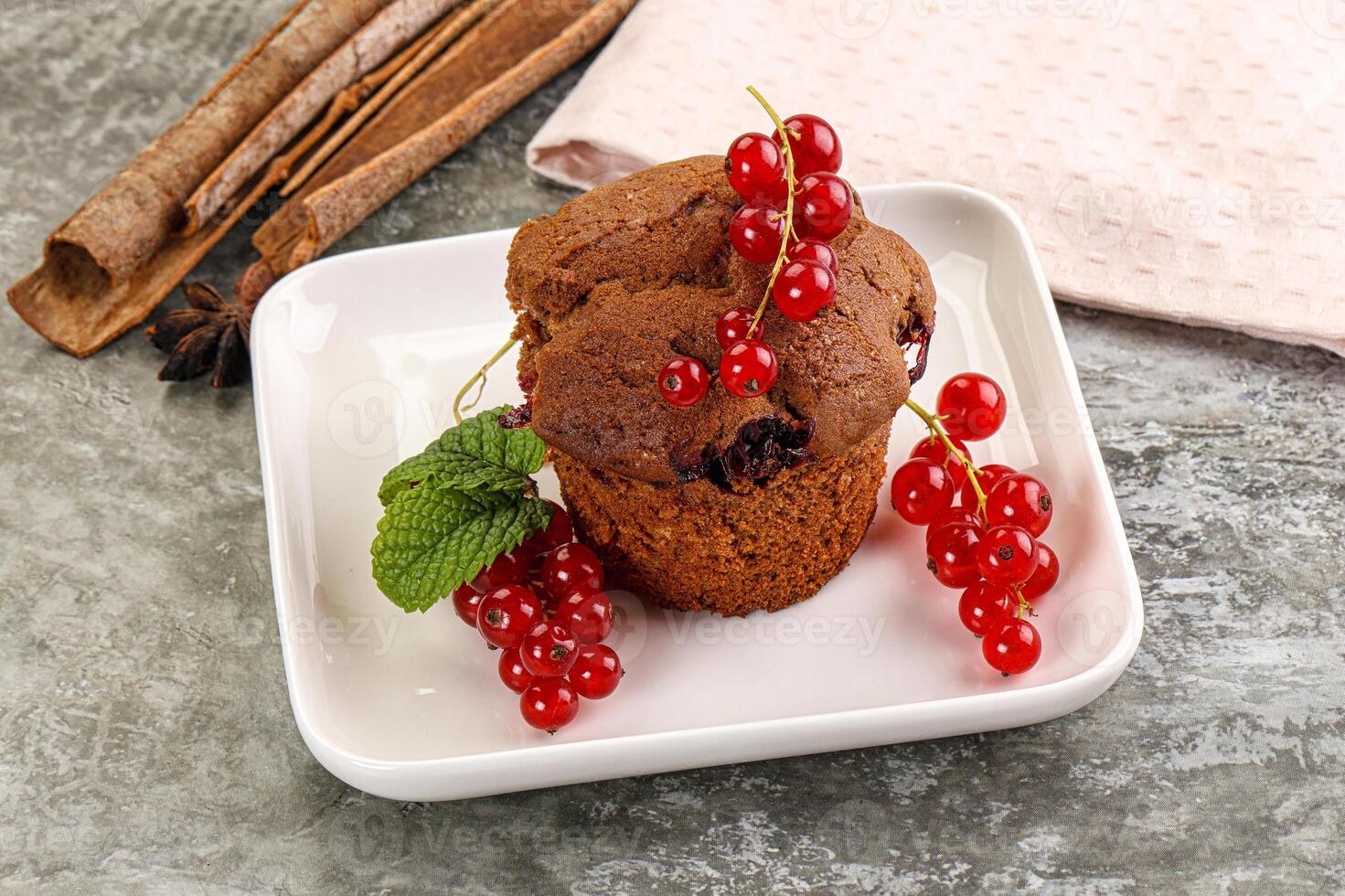 Delicous cupcake with red currant photo
