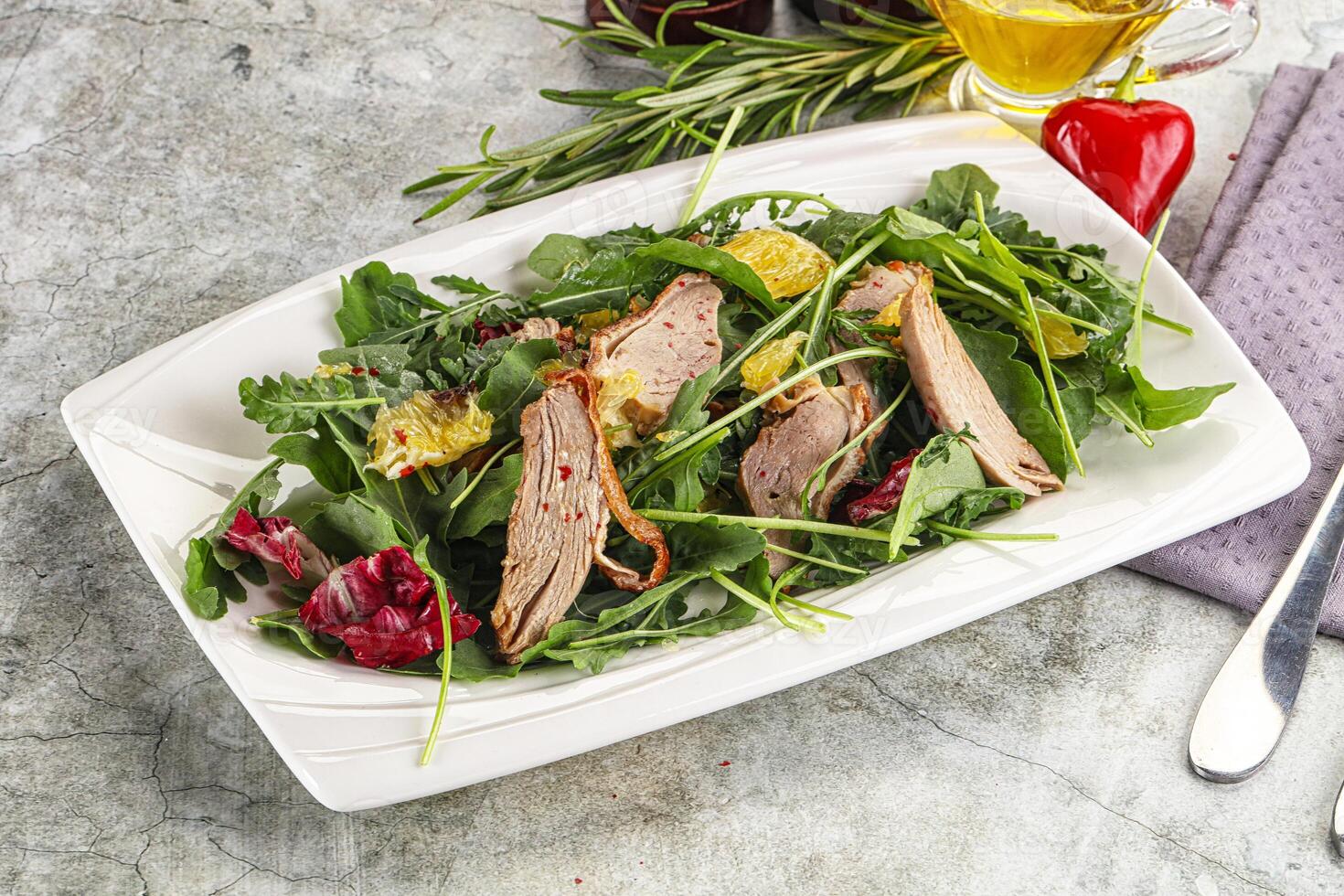 Salad with roasted duck and orange photo