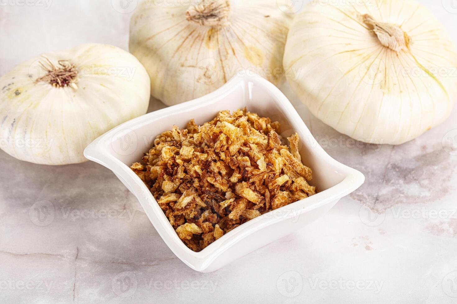 Dried roasted onion flakes for culinary photo