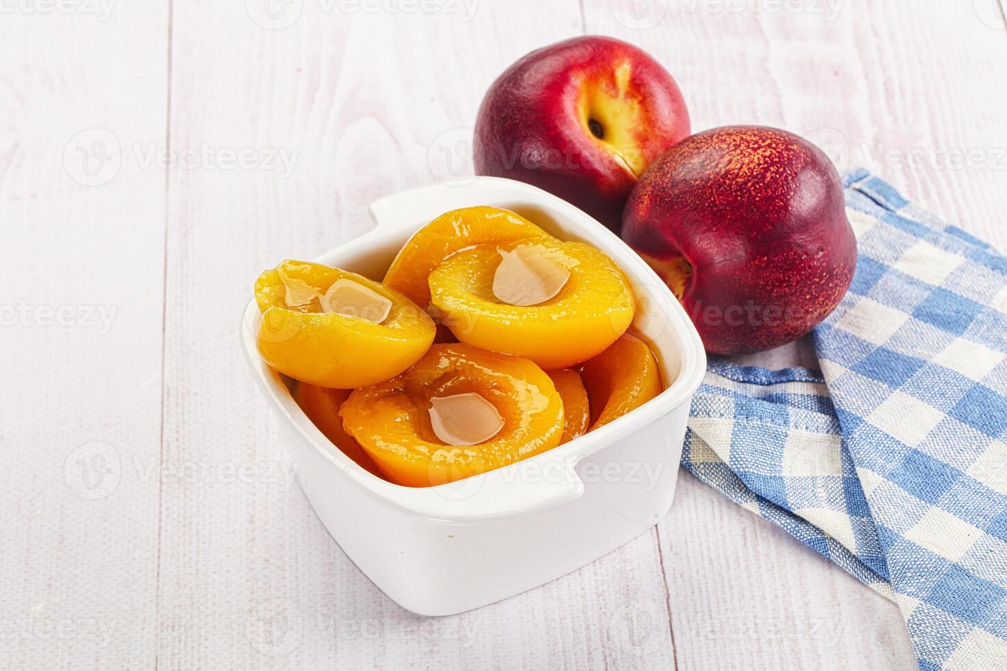 Canned peaches with sweet syrope photo