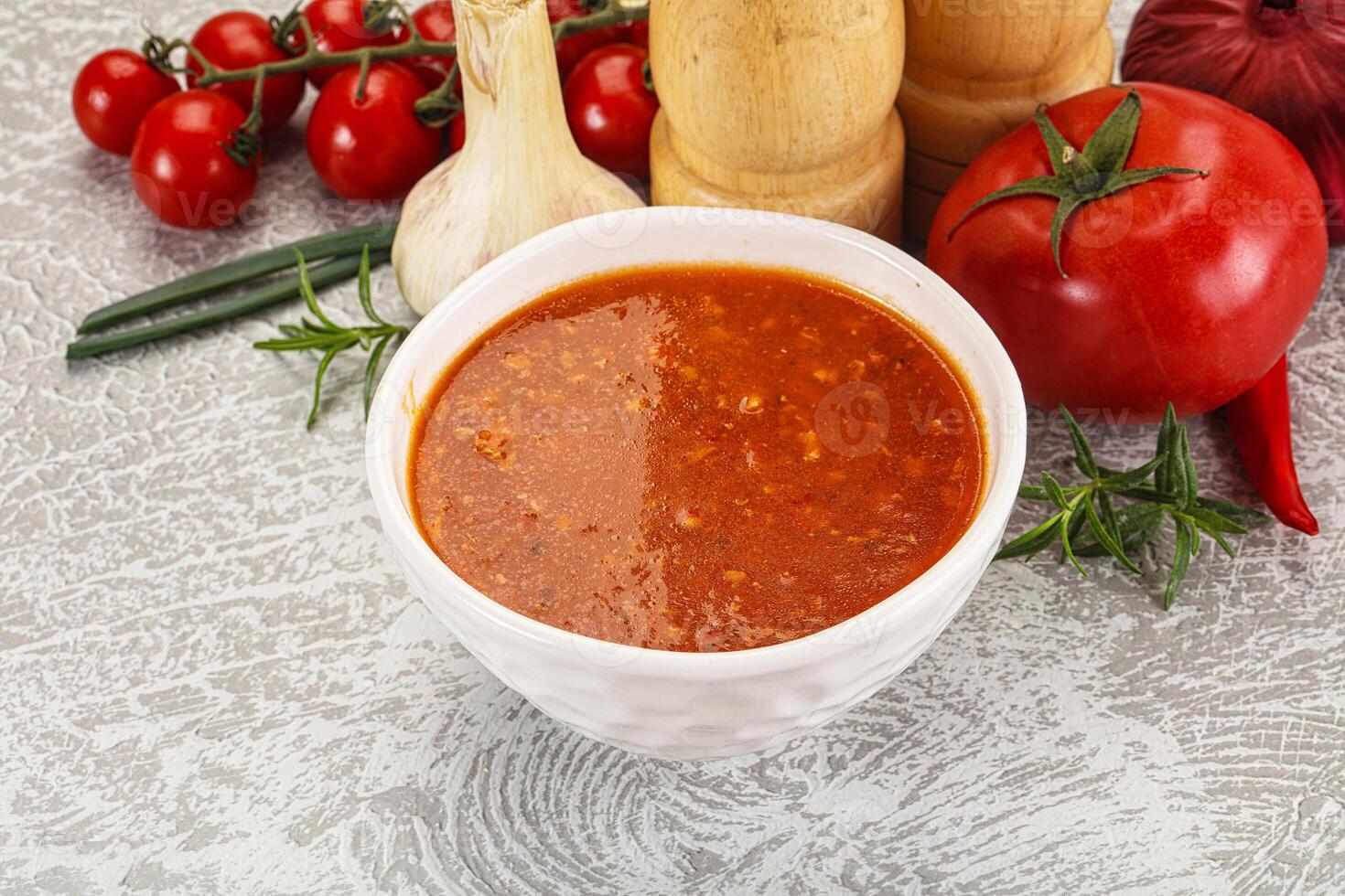 Hot tomato soup with diced chicken photo