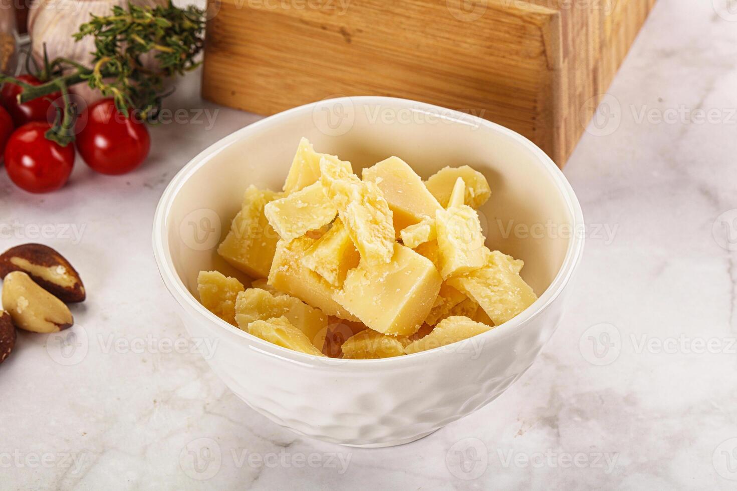 Crushed parmesan cheese in the bowl photo