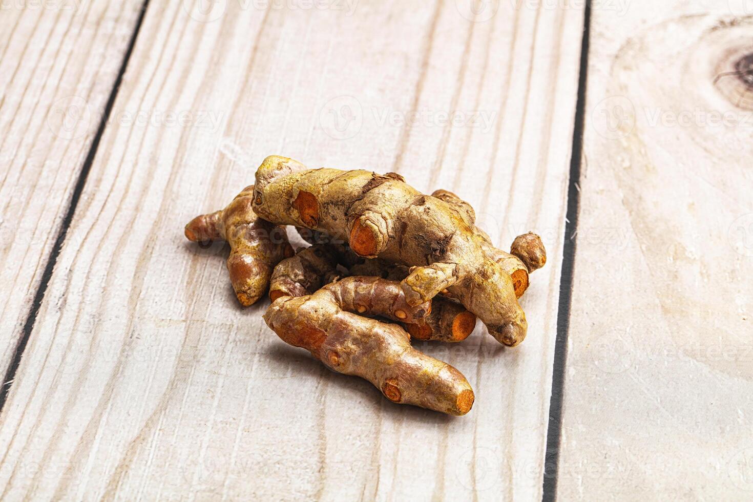 Fresh young Tumeric root heap photo