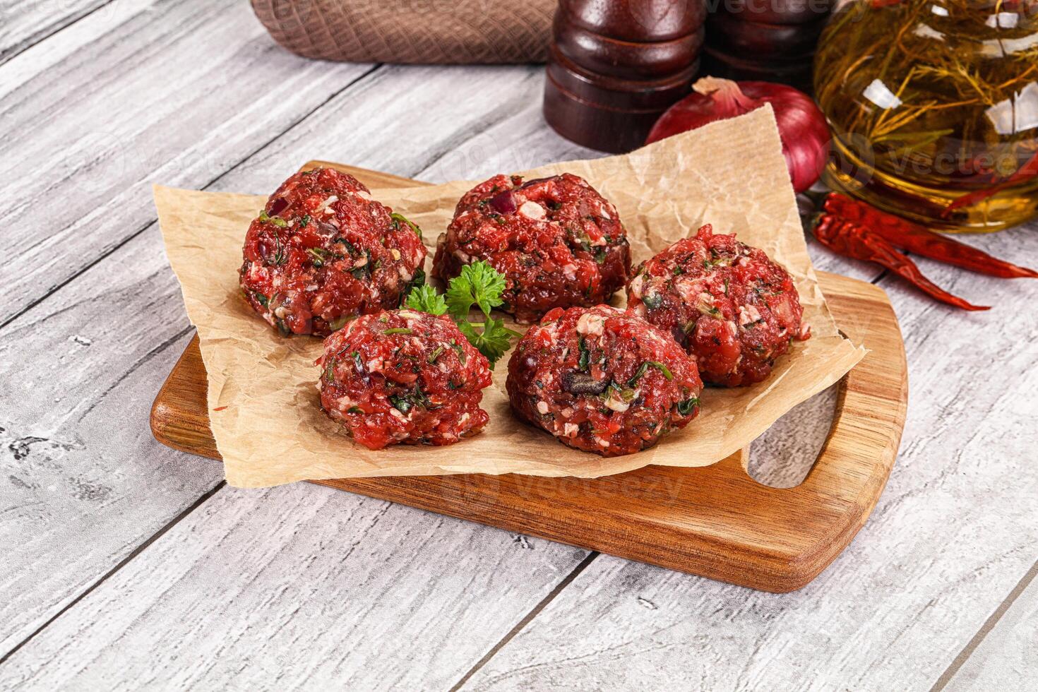 Raw beef meatballs for cooking photo