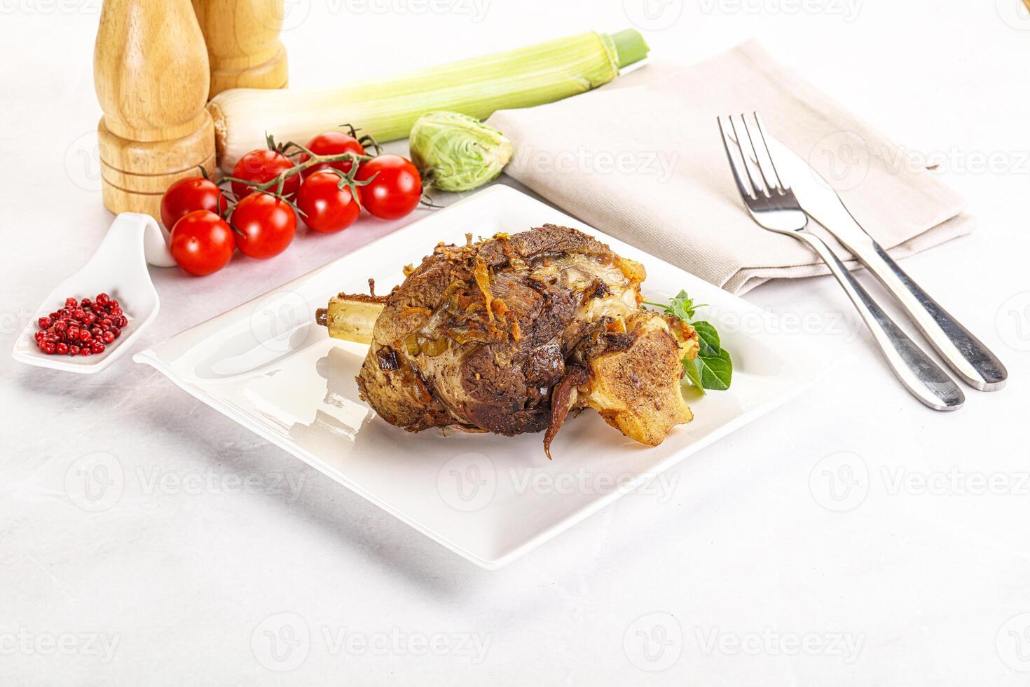 Baked Lamb shank with bone photo