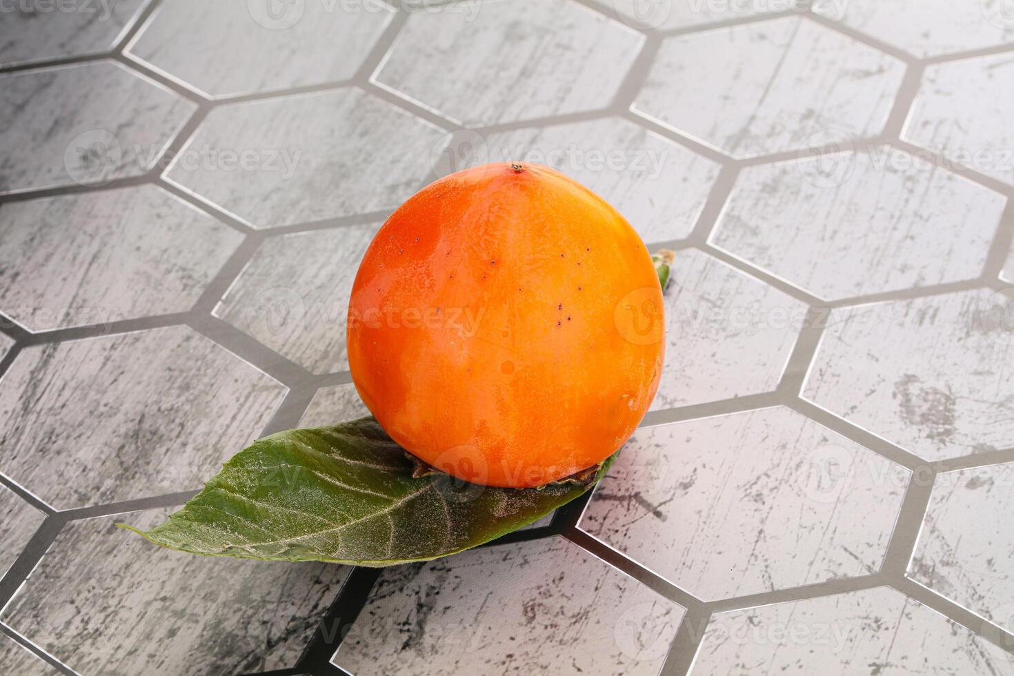 Fresh ripe sweet juicy persimmon photo