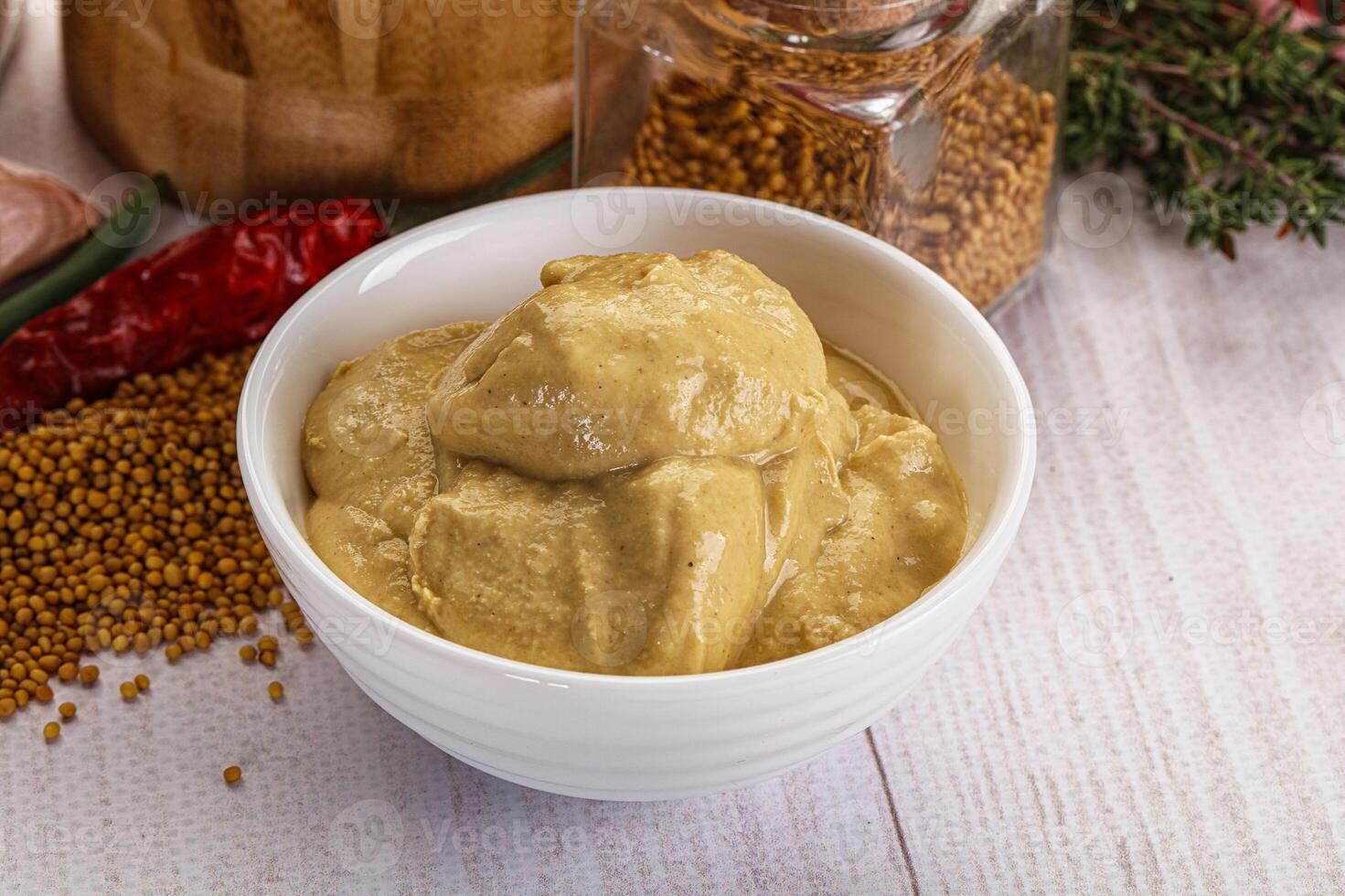 Dijon mustard sauce in the bowl photo