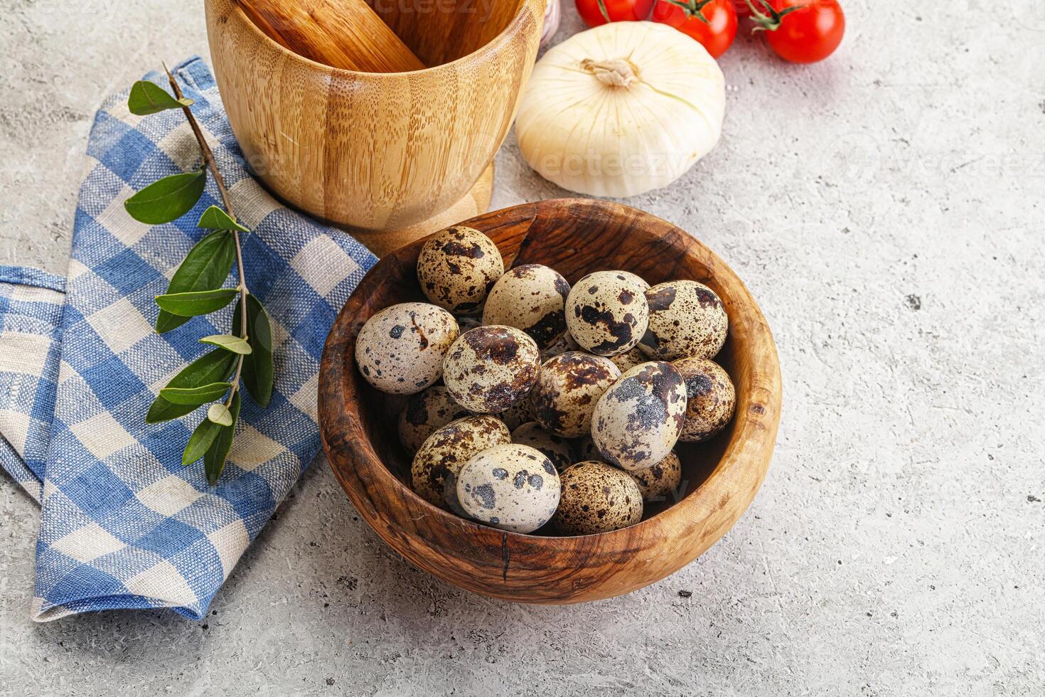 Raw quail eggs in the bowl photo