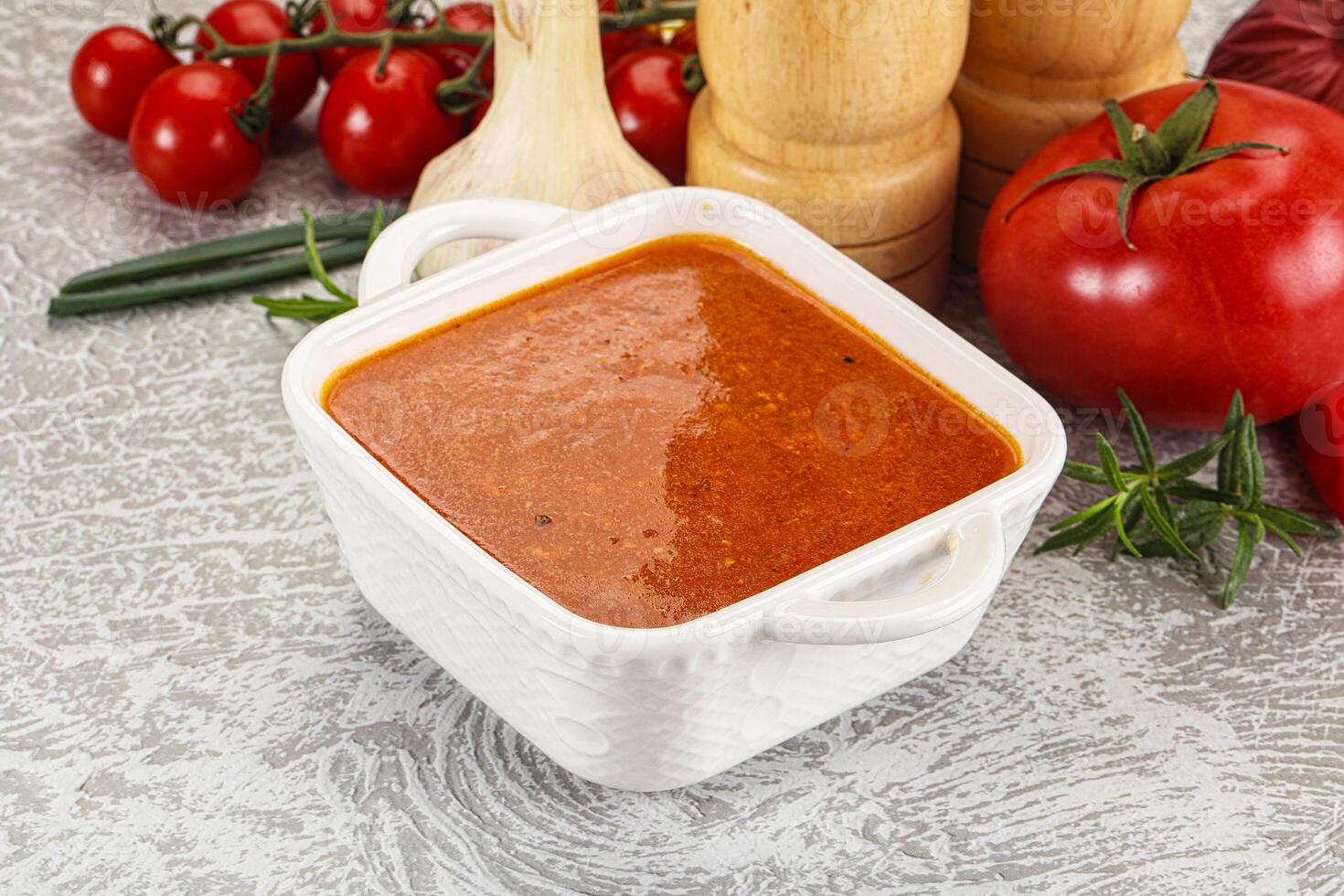 Hot tomato soup with diced chicken photo
