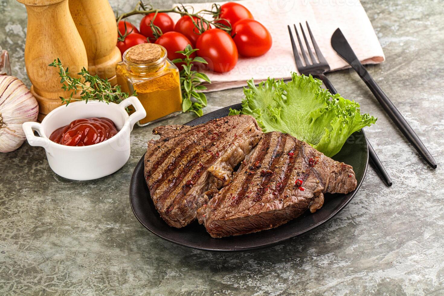 Delicus grilled beef steak with sauce photo