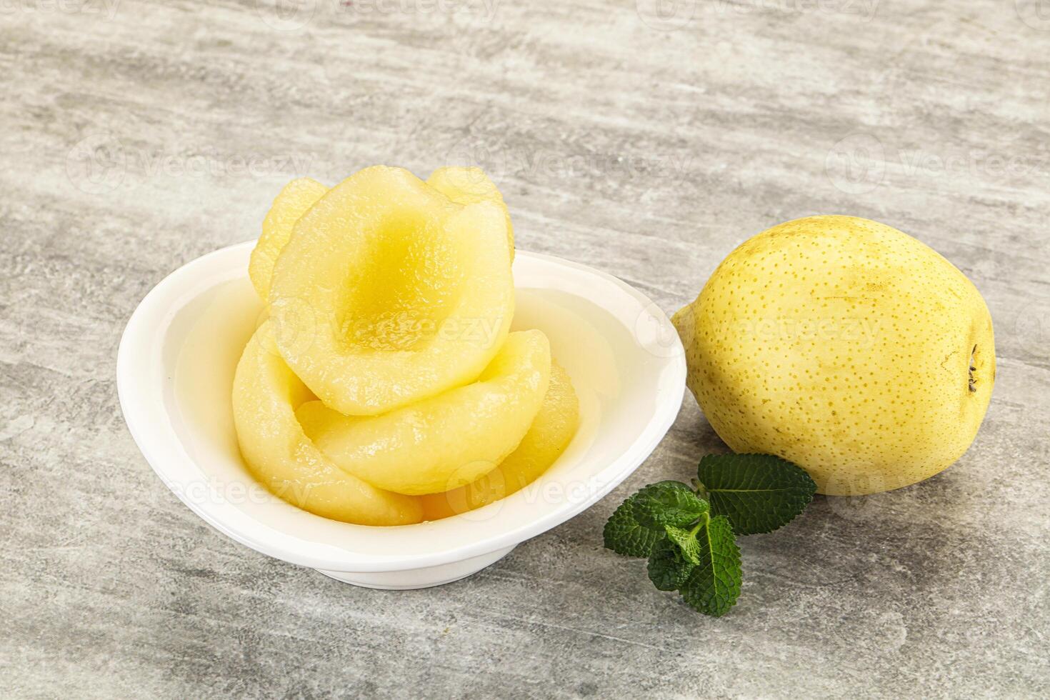 Canned yellow pear with syrup photo
